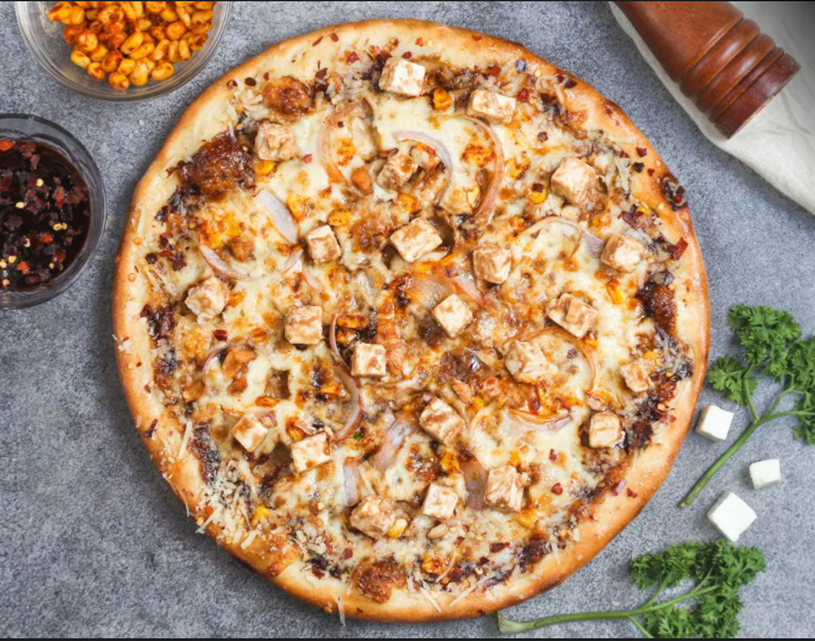 Pizza with greek pitta bread base